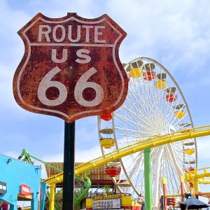 Red Route 66 Sign in front of a ferris wheel